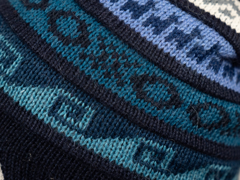 Alpaca Mütze 2in1 (Chullo) Schwarz mit diversen bläulichen Mustern